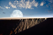image of moon Full moon rising above a sand dune.