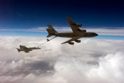 A KC-135 Stratotanker refueling a F/A-18 Hornet. 