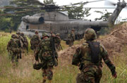 Marines approach a CH-53D Sea Stallion 