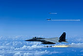 F-15 Eagle aircraft fire AIM-7 Sparrow missiles.
