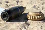 Converted ordnance shell and a simple mine.