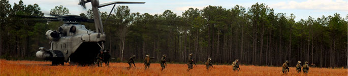 Marines offload a CH-53E Super Stallion.