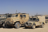 ACH100154M
A British Armed Forces Snatch Land Rover parked next to other military vehicles.