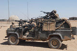 ACH100180M
British paratroopers on patrol in their Land Rover.