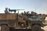 ACH100188M
British soldiers in their Land Rovers at Camp Bastion, Afghanistan.