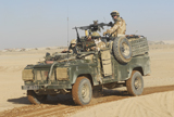 ACH100207M
British soldiers patrol Afghanistan in a Land Rover.