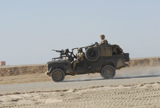 ACH100214M
British soldiers patrol Afghanistan in a Land Rover.