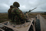 ACH100260M
A soldier mans a .50 caliber machine gun atop a Pink Panther Land Rover.