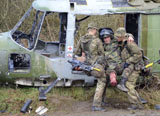 ACH100333M
British soldiers help a simulated casualty from a crashed helicopter.