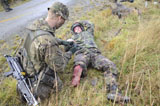 ACH100334M
A patrol medic applies first aid to a simulated casualty.