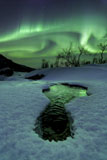 AHE100077S
Aurora Borealis over a frozen river, Norway.