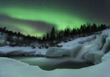 AHE100105S
A wintery waterfall and aurora borealis over Tennevik River, Norway.