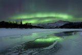 AHE100108S
Reflected aurora over a frozen Laksa Lake, Nordland, Norway.