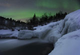 AHE100115S
A wintery waterfall and aurora borealis over Tennevik River, Norway.