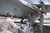 HGP100003M
Weapons crew prepare to load an AIM-120 missile on an F-15 Eagle.