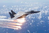HGP100086M
An F-15 Eagle releases flares over the Pacific Ocean.