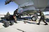 HGP100379M
Maintenance crew loads an AGM-65 Maverick missile on an A-10 Thunderbolt.