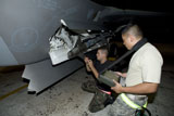 HGP100401M
Maintence crew works on an F-22 Raptor.