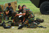 JAE100160M
Soldiers of a Belgian Infantry unit helping out a wounded colleague on the field.