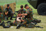 JAE100161M
Soldiers of a Belgian Infantry unit helping out a wounded colleague on the field.