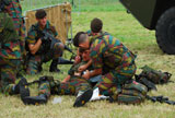 JAE100162M
Soldiers of a Belgian Infantry unit helping out a wounded colleague on the field.