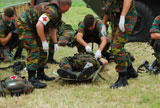 JAE100164M
Soldiers of a Belgian Infantry unit helping out a wounded colleague on the field.