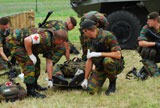 JAE100165M
Soldiers of a Belgian Infantry unit helping out a wounded colleague on the field.
