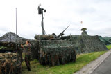 JAE100190M
A soldier of the Belgian Army inspecting a unit on the field.