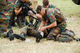 JAE100192M
Soldiers of a Belgian Infantry unit helping out a wounded colleague on the field.