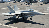 RGU100065M
An F/A-18 Hornet of the U.S. Navy landing aboard USS Eisenhower.