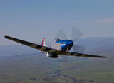 SGR100098M
A P-51D Mustang in flight over Hollister, California.