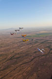 SGR100104M
Extra 300 aerobatic aircraft fly in formation over Mesa, Arizona.