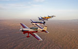 SGR100108M
Extra 300 aerobatic aircraft fly in formation over Mesa, Arizona.