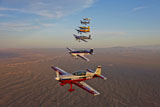 SGR100109M
Extra 300 aerobatic aircraft fly in formation over Mesa, Arizona.