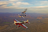 SGR100110M
Extra 300 aerobatic aircraft fly in formation over Mesa, Arizona.
