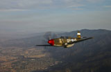 SGR100123M
P-51B Mustang in flight over China, California.