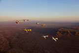 SGR100141M
Extra 300 aerobatic aircraft fly in formation over Mesa, Arizona.