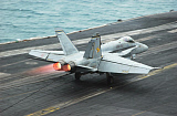 STK100203M
An F/A-18C Hornet makes an arrested landing on the aircraft carrier USS Theodore Roosevelt.