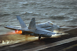 STK100213M
An F/A-18C Hornet launches from the flight deck of USS Theodore Roosevelt.