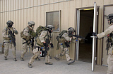 STK100500M
Pararescuemen enter a building to retrive wounded hostages.