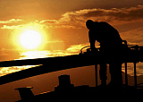 STK100707M
Crew Chief of an HH-60 Pave Hawk inspects his helicopter.