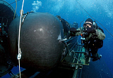 STK100997M
Divers prepare to launch a SEAL Delivery Vehicle.