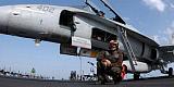 STK101151M
A plane captain prepares for flight operations aboard USS Theodore Roosevelt.