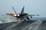 STK101154M
An F/A-18 Hornet launches from the flight deck aboard USS Theodore Roosevelt.