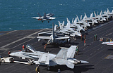 STK101175M
An F/A-18C Hornet launches from the flight deck aboard USS Theodore Roosevelt.
