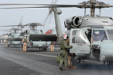 STK101201M
Helicopter crews change out on the flight deck aboard USS Theodore Roosevelt.