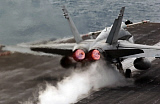 STK101232M
An F/A-18 Hornet launches from the flight deck aboard USS Theodore Roosevelt.