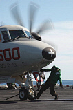 STK101252M
A flight deck crew member performs final checks on an E-2C Hawkeye.