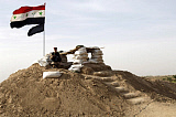 STK101319M
An Iraqi Army soldier stands guard at a new Iraqi guard station.
