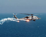 STK101439M
A U.S. Navy HH-60H Seahawk Helicopter dispenses flares and chaff.